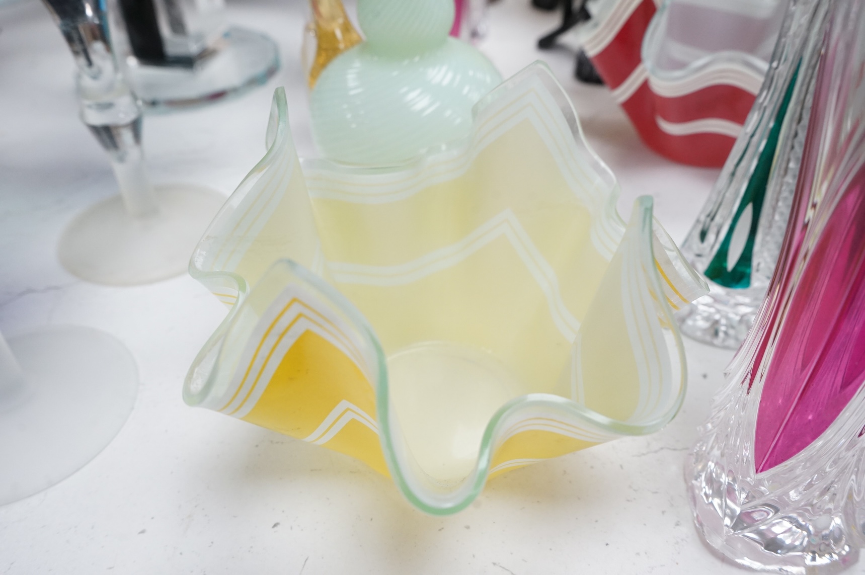 Mixed glassware to include a green Mary Gregory jug, a 'vaseline' glass ewer, an Art Deco style clear and black glass fruit tazza, etc.